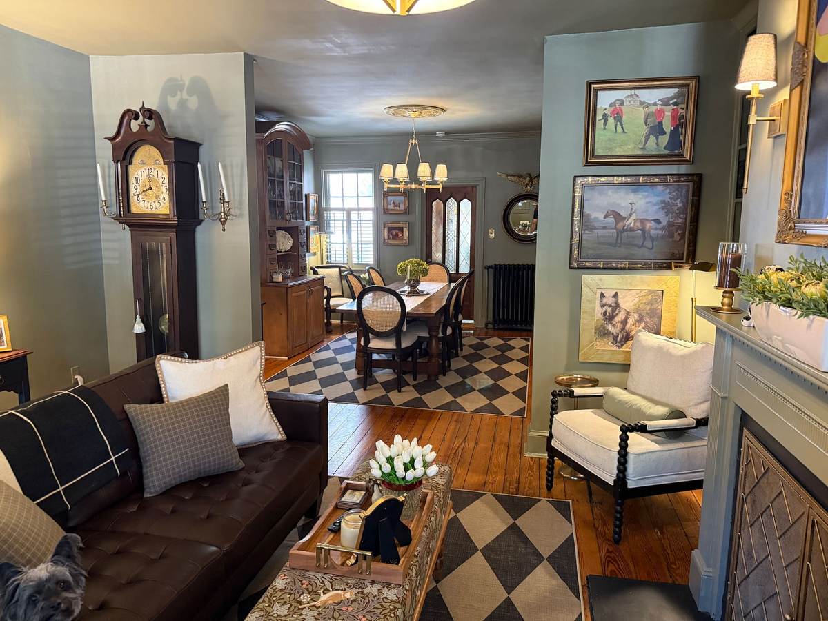 The living room at Strohm House looking through to the dining room, an 1870 Victorian in the Annapolis historic district, available as a 2027 legislative session rental